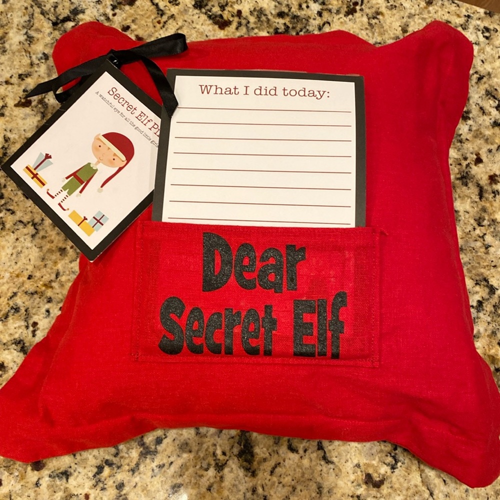 Petal Lane “Dear Secret Elf” pillow. 10” pillow with removable red slip cover.